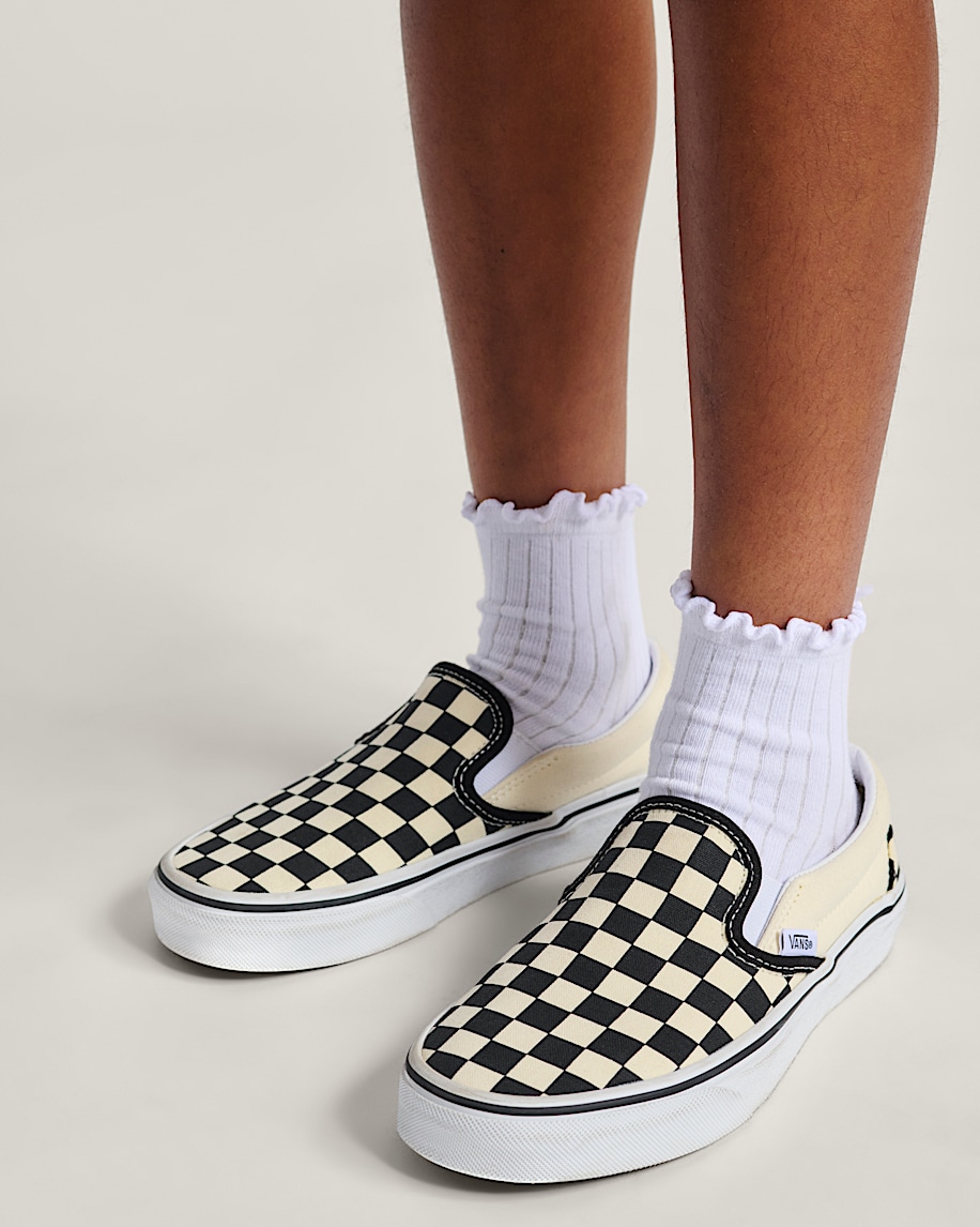 klassiska slip-on-skor för stora barn i schackrutigt utförande